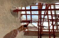 Rebar primer being applied to rebar to create strength